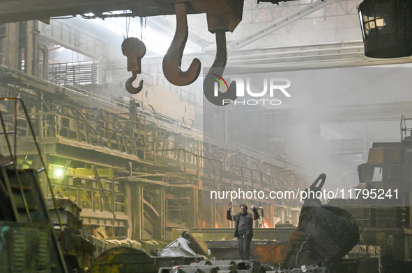 An employee works in an open-hearth furnace shop at Zaporizhstal PJSC in Zaporizhzhia, Ukraine, on November 13, 2024. NO USE RUSSIA. NO USE...