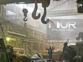 An employee works in an open-hearth furnace shop at Zaporizhstal PJSC in Zaporizhzhia, Ukraine, on November 13, 2024. NO USE RUSSIA. NO USE...