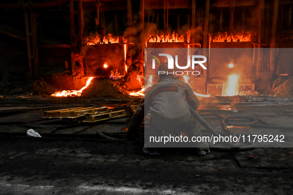 An employee works in an open-hearth furnace shop at Zaporizhstal PJSC in Zaporizhzhia, Ukraine, on November 13, 2024. NO USE RUSSIA. NO USE...