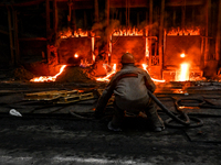 An employee works in an open-hearth furnace shop at Zaporizhstal PJSC in Zaporizhzhia, Ukraine, on November 13, 2024. NO USE RUSSIA. NO USE...