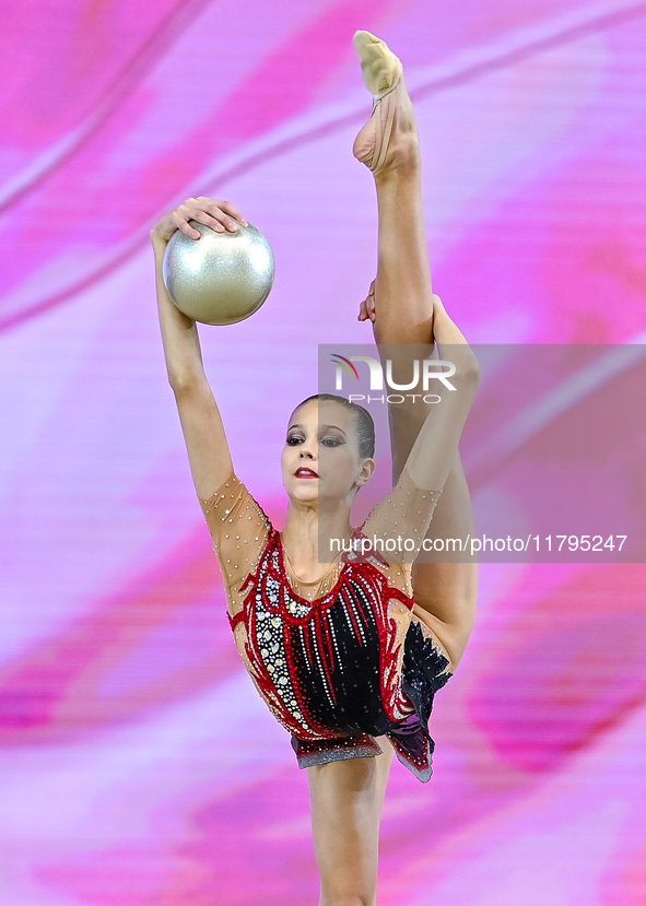 Marharyta Raksa of Belarus performs the ball exercise during the juniors apparatus finals of the International Rhythmic Gymnastics Tournamen...