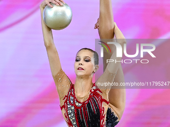 Marharyta Raksa of Belarus performs the ball exercise during the juniors apparatus finals of the International Rhythmic Gymnastics Tournamen...