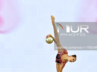 Marharyta Raksa of Belarus performs the ball exercise during the juniors apparatus finals of the International Rhythmic Gymnastics Tournamen...