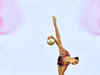 Marharyta Raksa of Belarus performs the ball exercise during the juniors apparatus finals of the International Rhythmic Gymnastics Tournamen...