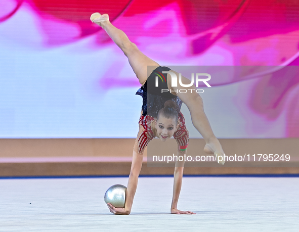 Marharyta Raksa of Belarus performs the ball exercise during the juniors apparatus finals of the International Rhythmic Gymnastics Tournamen...