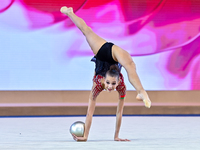 Marharyta Raksa of Belarus performs the ball exercise during the juniors apparatus finals of the International Rhythmic Gymnastics Tournamen...