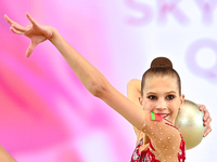 Marharyta Raksa of Belarus performs the ball exercise during the juniors apparatus finals of the International Rhythmic Gymnastics Tournamen...