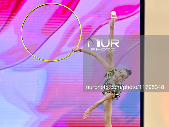 Nika Kostsina of Belarus performs the Hoop exercise during the juniors apparatus finals of the International Rhythmic Gymnastics Tournament...