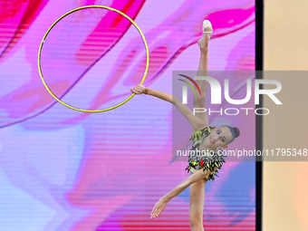 Nika Kostsina of Belarus performs the Hoop exercise during the juniors apparatus finals of the International Rhythmic Gymnastics Tournament...