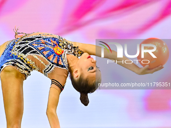 Ksenha Savinova of Russia performs the Ball exercise during the juniors apparatus finals of the International Rhythmic Gymnastics Tournament...