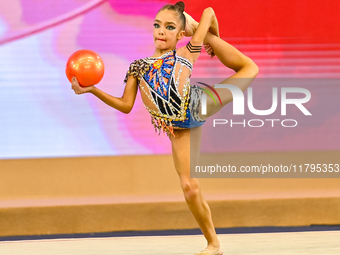 Ksenha Savinova of Russia performs the Ball exercise during the juniors apparatus finals of the International Rhythmic Gymnastics Tournament...