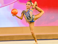 Ksenha Savinova of Russia performs the Ball exercise during the juniors apparatus finals of the International Rhythmic Gymnastics Tournament...