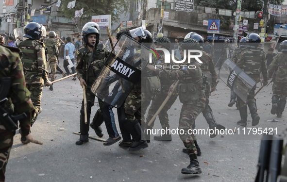 Bangladesh Armed Force personnel arrest picketers amid a clash in Dhaka, Bangladesh, on November 20, 2024. 