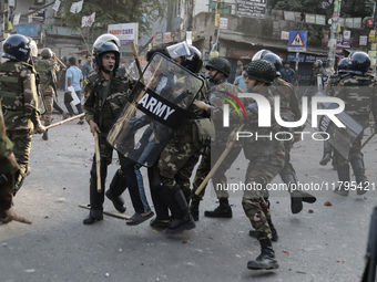 Bangladesh Armed Force personnel arrest picketers amid a clash in Dhaka, Bangladesh, on November 20, 2024. (