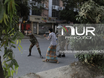 Bangladesh Armed Force personnel arrest picketers amid a clash in Dhaka, Bangladesh, on November 20, 2024. (