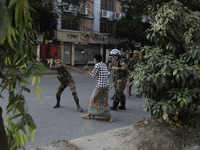 Bangladesh Armed Force personnel arrest picketers amid a clash in Dhaka, Bangladesh, on November 20, 2024. (