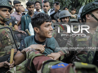 Bangladesh Armed Force personnel arrest picketers amid a clash in Dhaka, Bangladesh, on November 20, 2024. (