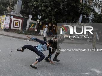 Bangladesh Armed Force personnel arrest picketers amid a clash in Dhaka, Bangladesh, on November 20, 2024. (