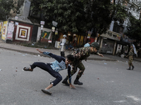 Bangladesh Armed Force personnel arrest picketers amid a clash in Dhaka, Bangladesh, on November 20, 2024. (