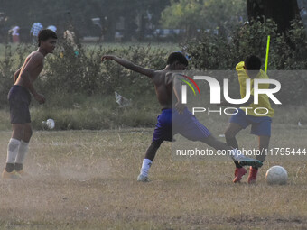 Boys practice football at a ground in Kolkata, India, on October 20, 2024, during a winter afternoon. (