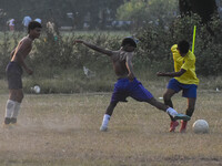 Boys practice football at a ground in Kolkata, India, on October 20, 2024, during a winter afternoon. (