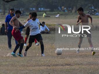 Boys practice football at a ground in Kolkata, India, on October 20, 2024, during a winter afternoon. (