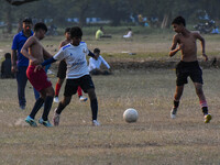 Boys practice football at a ground in Kolkata, India, on October 20, 2024, during a winter afternoon. (