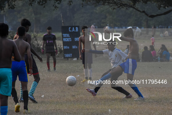 Boys practice football at a ground in Kolkata, India, on October 20, 2024, during a winter afternoon. 