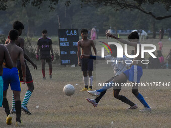 Boys practice football at a ground in Kolkata, India, on October 20, 2024, during a winter afternoon. (