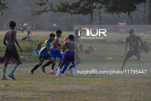 Boys practice football at a ground in Kolkata, India, on October 20, 2024, during a winter afternoon. 