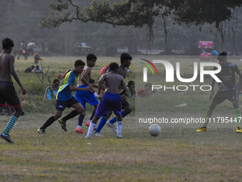 Boys practice football at a ground in Kolkata, India, on October 20, 2024, during a winter afternoon. (