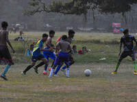 Boys practice football at a ground in Kolkata, India, on October 20, 2024, during a winter afternoon. (