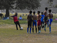 Boys practice football at a ground in Kolkata, India, on October 20, 2024, during a winter afternoon. (