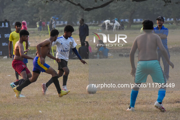 Boys practice football at a ground in Kolkata, India, on October 20, 2024, during a winter afternoon. 