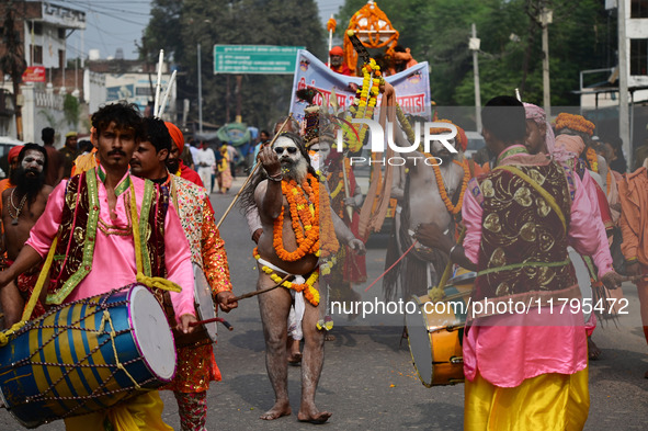 Indian Sadhus (holy men) of Shri Panch Dashnam Juna Akhara participate in a religious procession during the grand Nagar Pravesh ceremony for...