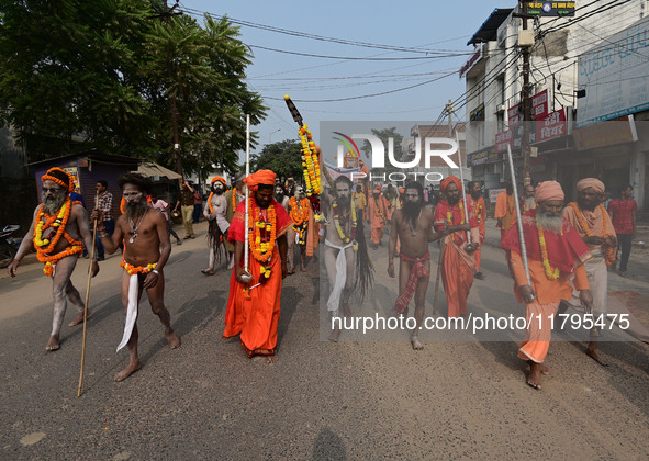 Indian Sadhus (holy men) of Shri Panch Dashnam Juna Akhara participate in a religious procession during the grand Nagar Pravesh ceremony for...