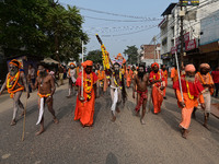 Indian Sadhus (holy men) of Shri Panch Dashnam Juna Akhara participate in a religious procession during the grand Nagar Pravesh ceremony for...