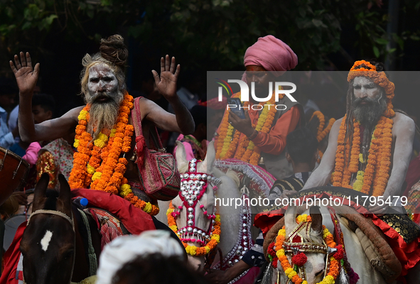 Indian Sadhus (holy men) of Shri Panch Dashnam Juna Akhara participate in a religious procession during the grand Nagar Pravesh ceremony for...