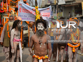 Indian Sadhus (holy men) of Shri Panch Dashnam Juna Akhara participate in a religious procession during the grand Nagar Pravesh ceremony for...