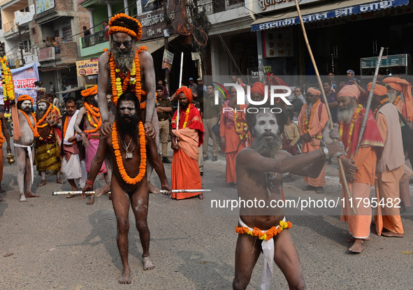 Indian Sadhus (holy men) of Shri Panch Dashnam Juna Akhara participate in a religious procession during the grand Nagar Pravesh ceremony for...