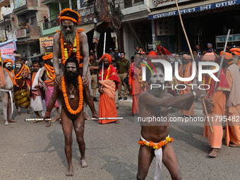 Indian Sadhus (holy men) of Shri Panch Dashnam Juna Akhara participate in a religious procession during the grand Nagar Pravesh ceremony for...