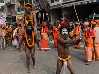 Indian Sadhus (holy men) of Shri Panch Dashnam Juna Akhara participate in a religious procession during the grand Nagar Pravesh ceremony for...