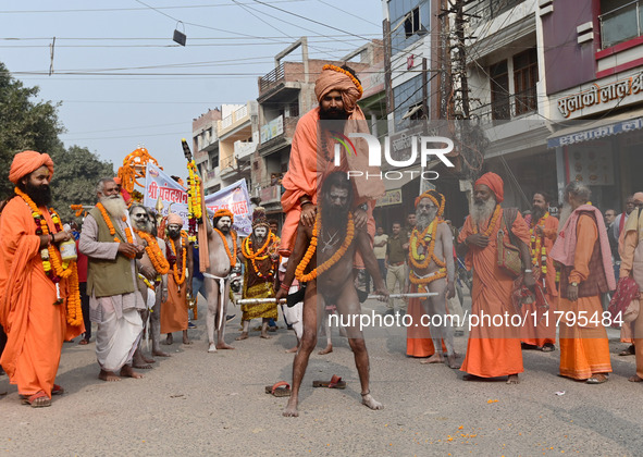 Indian Sadhus (holy men) of Shri Panch Dashnam Juna Akhara participate in a religious procession during the grand Nagar Pravesh ceremony for...