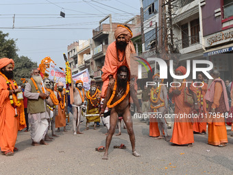 Indian Sadhus (holy men) of Shri Panch Dashnam Juna Akhara participate in a religious procession during the grand Nagar Pravesh ceremony for...