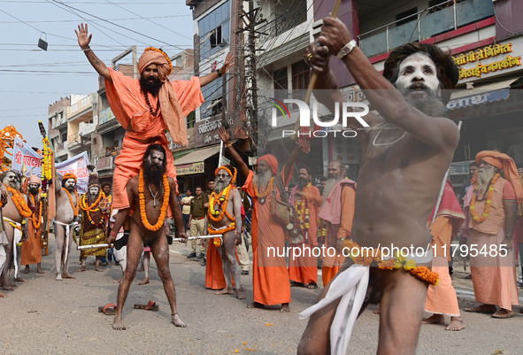 Indian Sadhus (holy men) of Shri Panch Dashnam Juna Akhara participate in a religious procession during the grand Nagar Pravesh ceremony for...