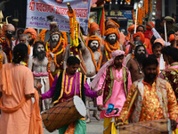 Indian Sadhus (holy men) of Shri Panch Dashnam Juna Akhara participate in a religious procession during the grand Nagar Pravesh ceremony for...