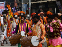 Indian Sadhus (holy men) of Shri Panch Dashnam Juna Akhara participate in a religious procession during the grand Nagar Pravesh ceremony for...