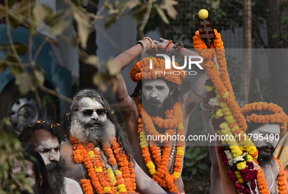 Indian Sadhus (holy men) of Shri Panch Dashnam Juna Akhara participate in a religious procession during the grand Nagar Pravesh ceremony for...