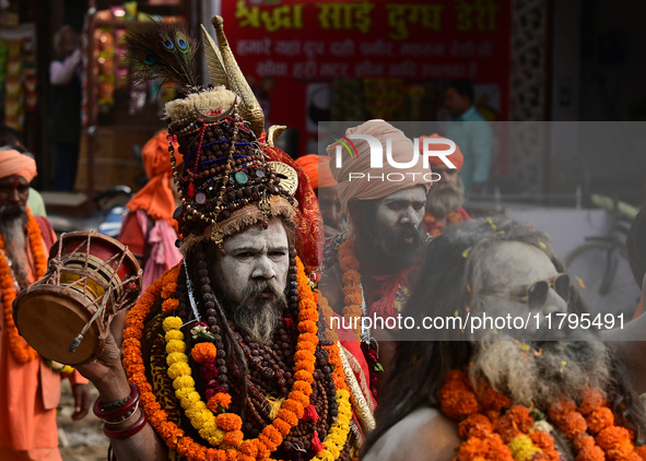 Indian Sadhus (holy men) of Shri Panch Dashnam Juna Akhara participate in a religious procession during the grand Nagar Pravesh ceremony for...