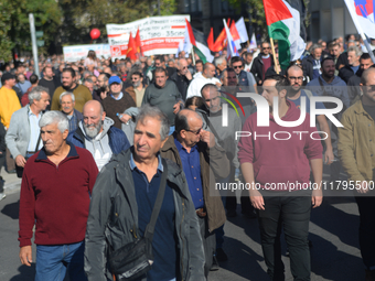 People demonstrate in the streets of Athens, Greece, on November 20, 2024, during a 24-hour nationwide strike called by unions against the r...